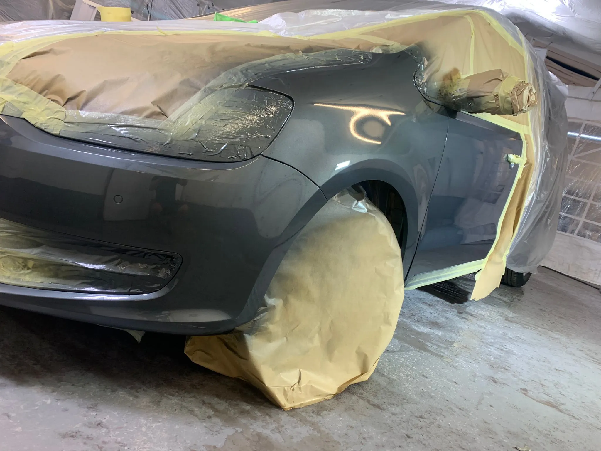 Car masked up for a body repair in the Body Tech Bracknell workshop