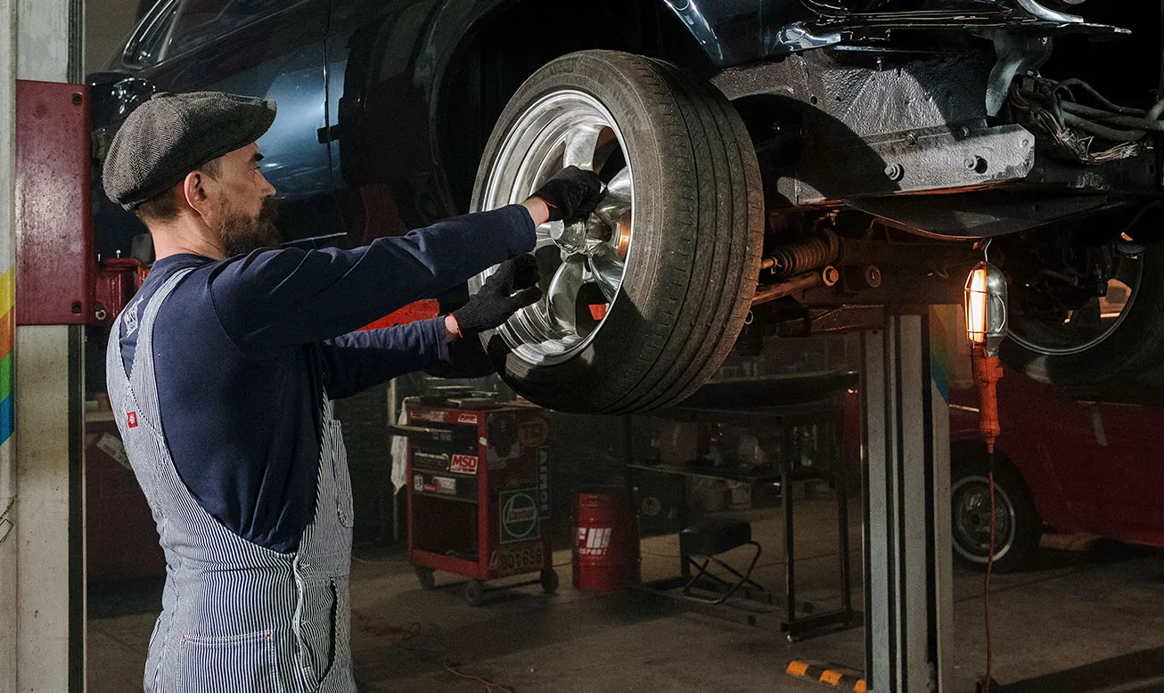 Technician repairing a car after an accident